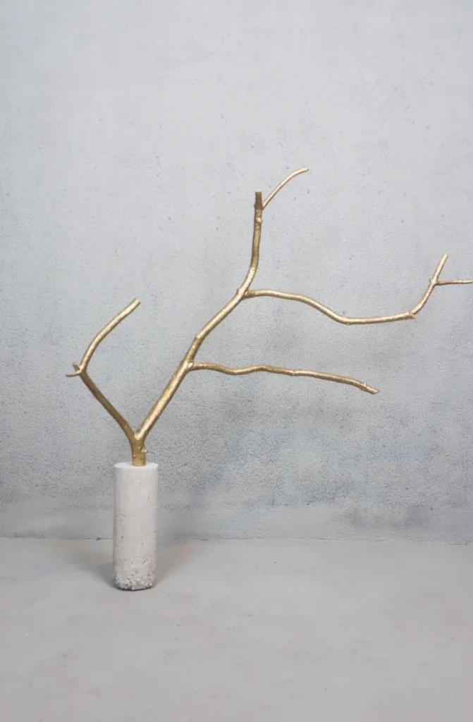 CONCRETE AND PAINTED DRIED WOODEN BRANCH